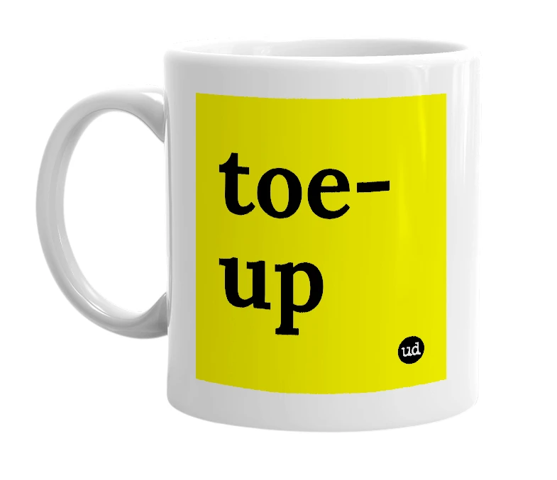 White mug with 'toe-up' in bold black letters