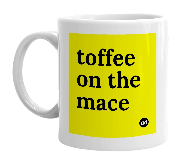 White mug with 'toffee on the mace' in bold black letters