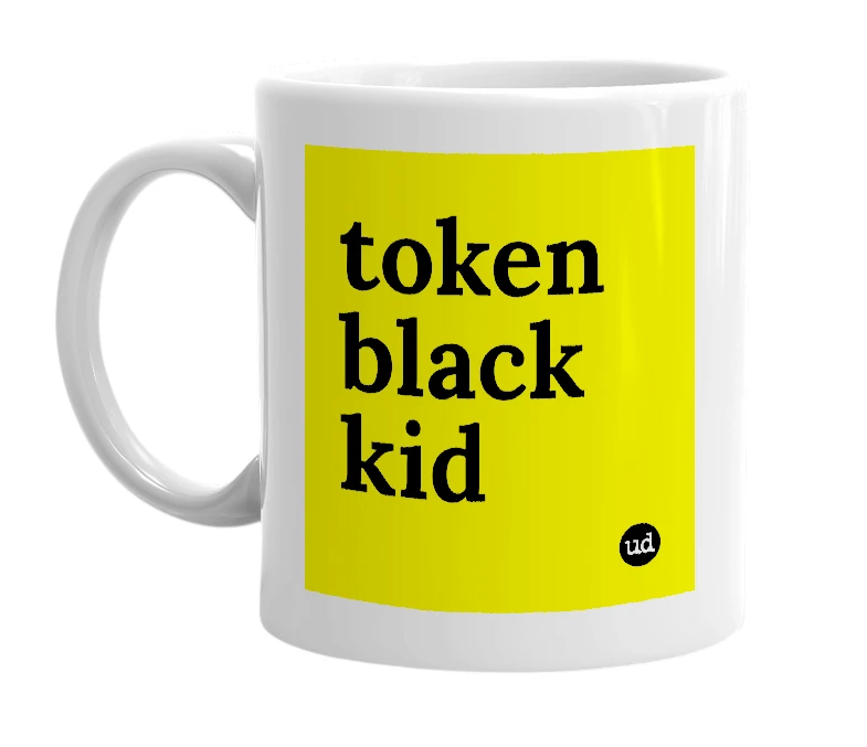 White mug with 'token black kid' in bold black letters
