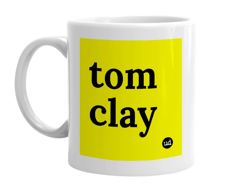 White mug with 'tom clay' in bold black letters