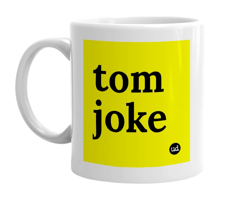 White mug with 'tom joke' in bold black letters