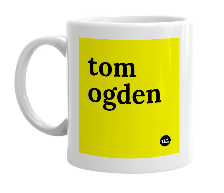 White mug with 'tom ogden' in bold black letters