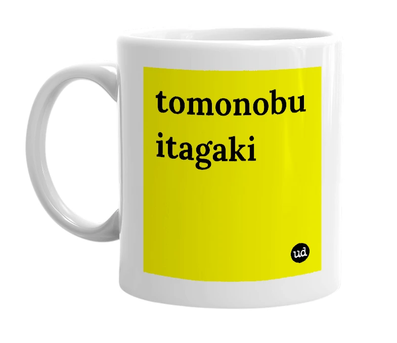 White mug with 'tomonobu itagaki' in bold black letters