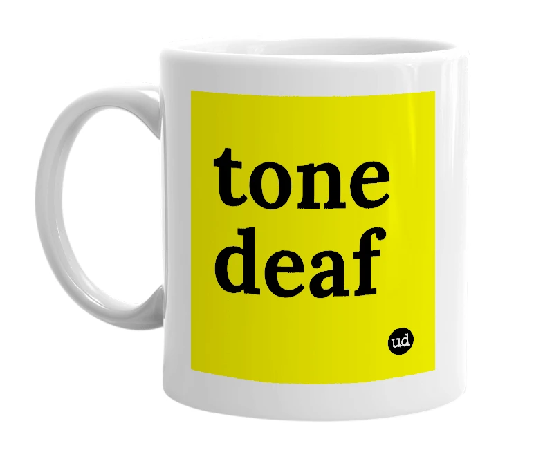 White mug with 'tone deaf' in bold black letters