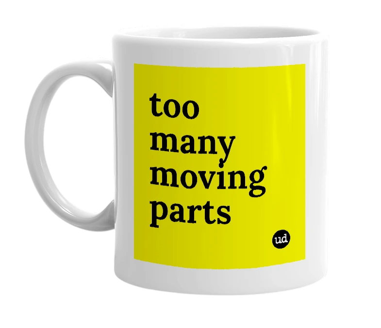 White mug with 'too many moving parts' in bold black letters