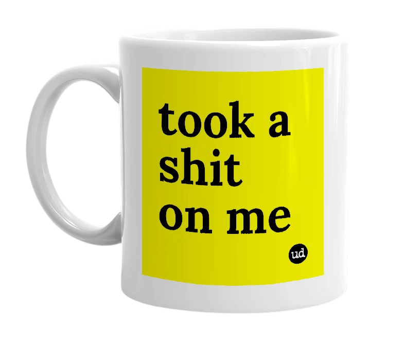 White mug with 'took a shit on me' in bold black letters