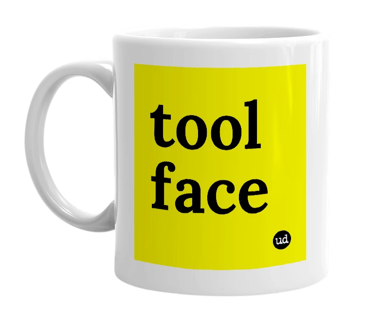 White mug with 'tool face' in bold black letters