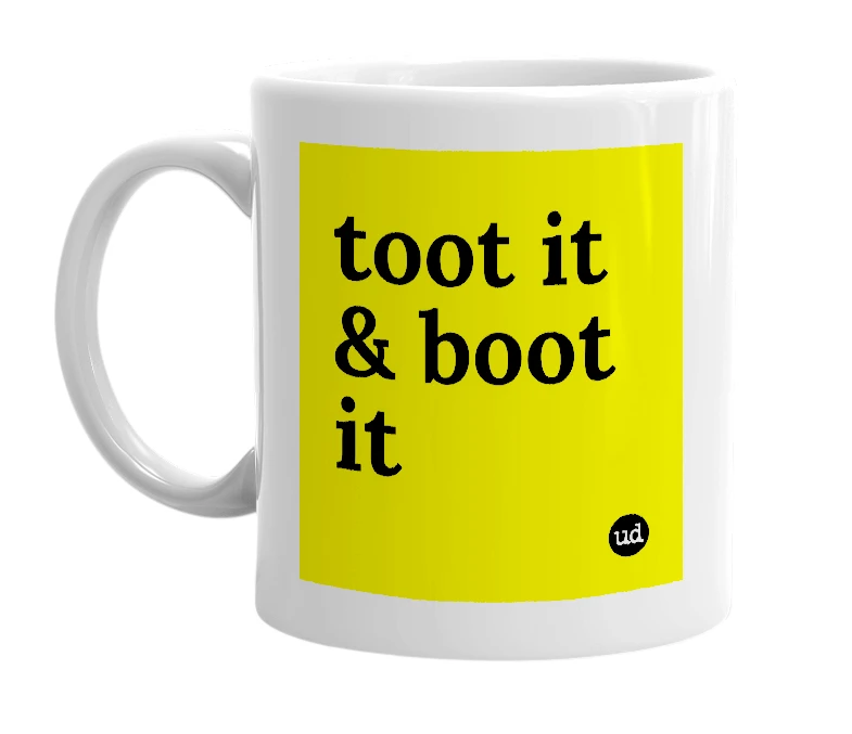 White mug with 'toot it & boot it' in bold black letters