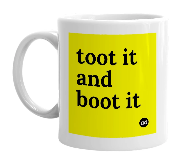 White mug with 'toot it and boot it' in bold black letters