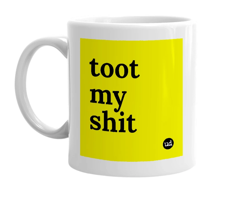 White mug with 'toot my shit' in bold black letters