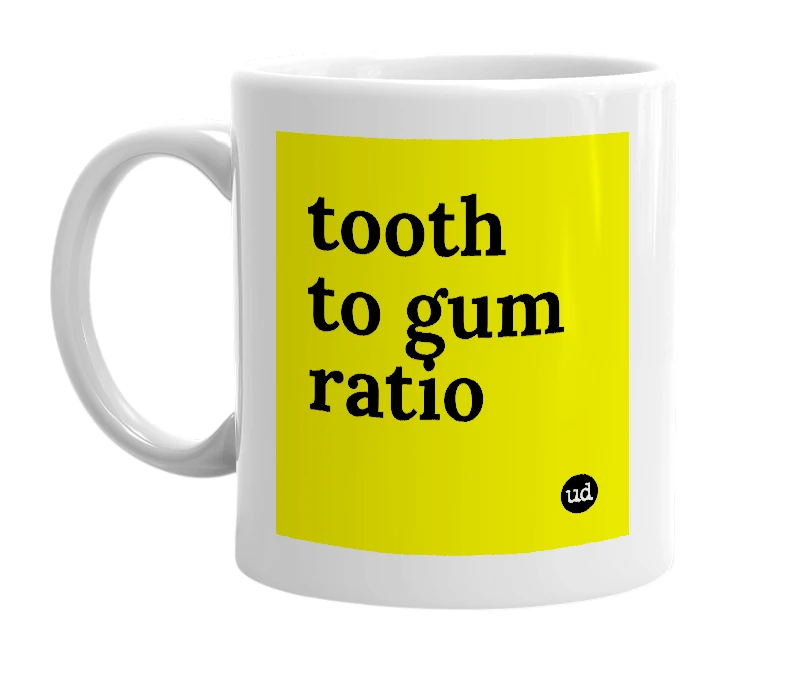 White mug with 'tooth to gum ratio' in bold black letters