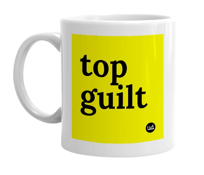White mug with 'top guilt' in bold black letters