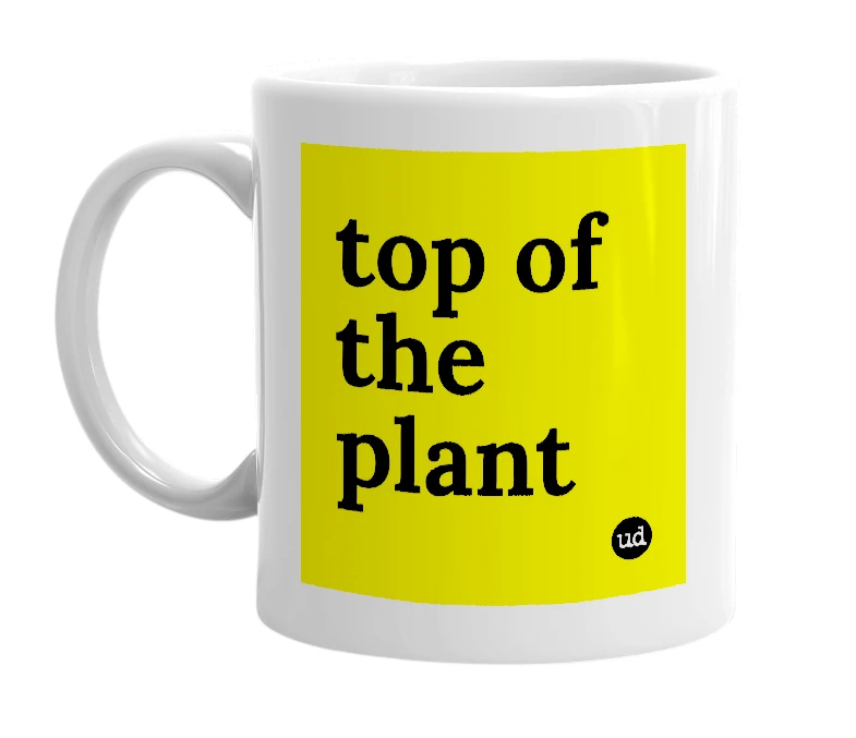 White mug with 'top of the plant' in bold black letters