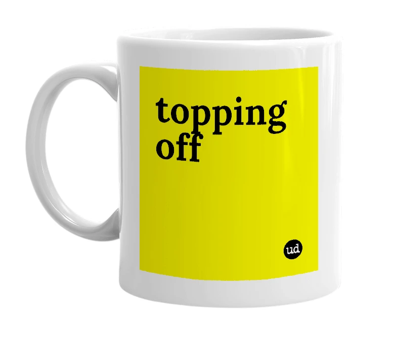 White mug with 'topping off' in bold black letters