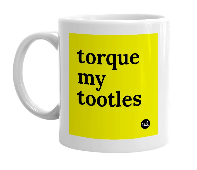 White mug with 'torque my tootles' in bold black letters
