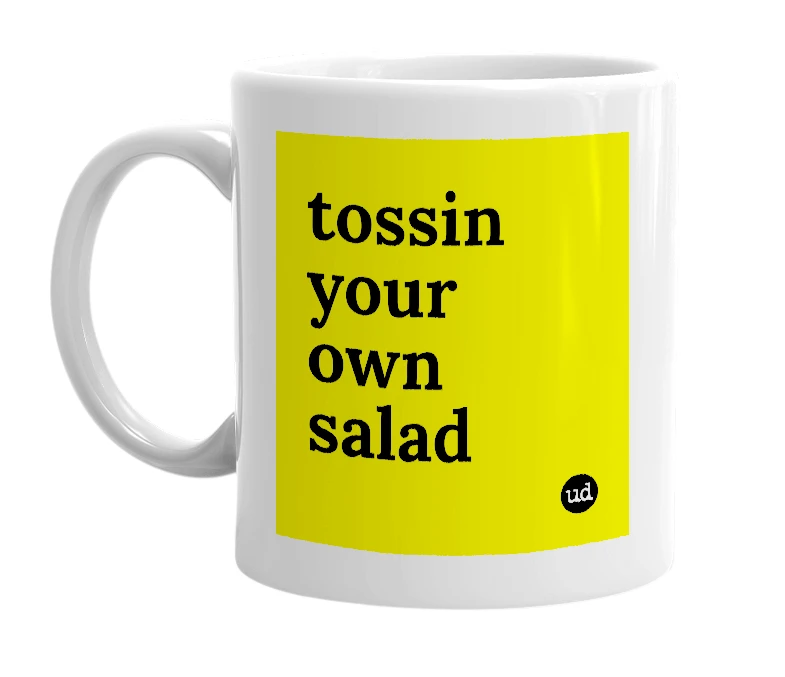 White mug with 'tossin your own salad' in bold black letters