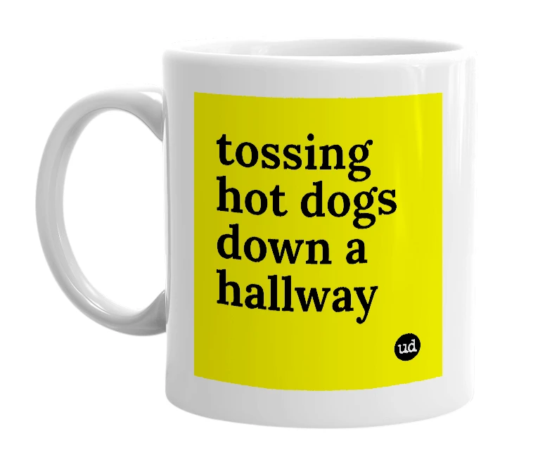 White mug with 'tossing hot dogs down a hallway' in bold black letters