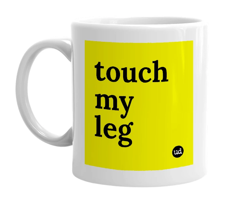 White mug with 'touch my leg' in bold black letters