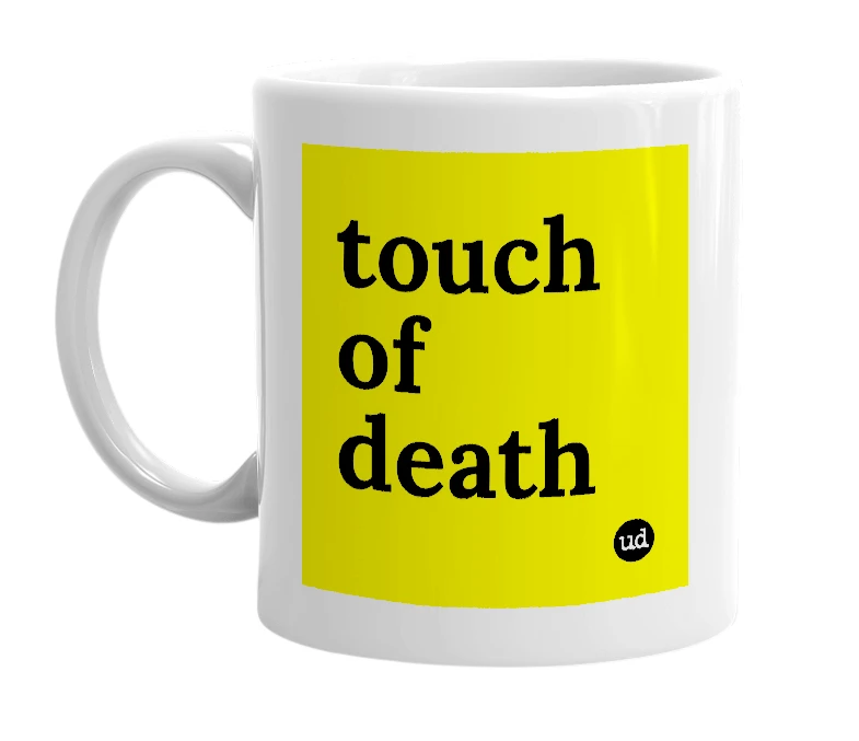 White mug with 'touch of death' in bold black letters