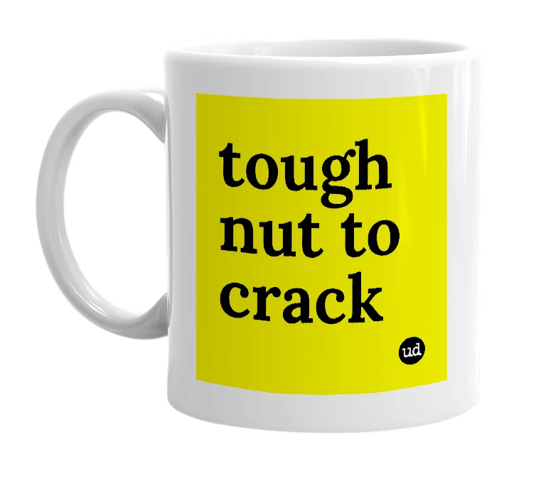White mug with 'tough nut to crack' in bold black letters
