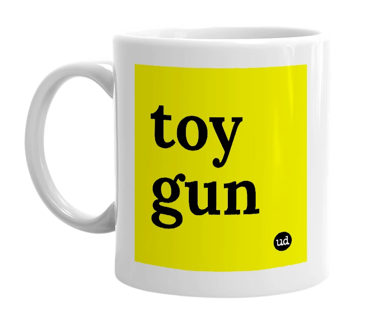 White mug with 'toy gun' in bold black letters