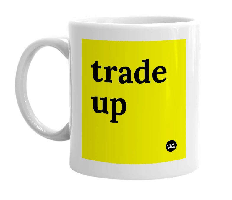 White mug with 'trade up' in bold black letters