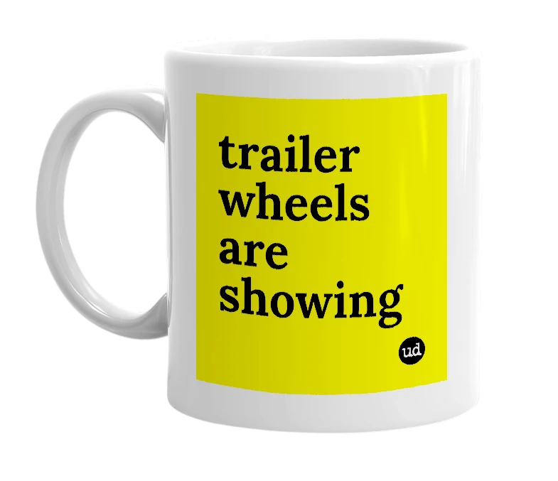 White mug with 'trailer wheels are showing' in bold black letters