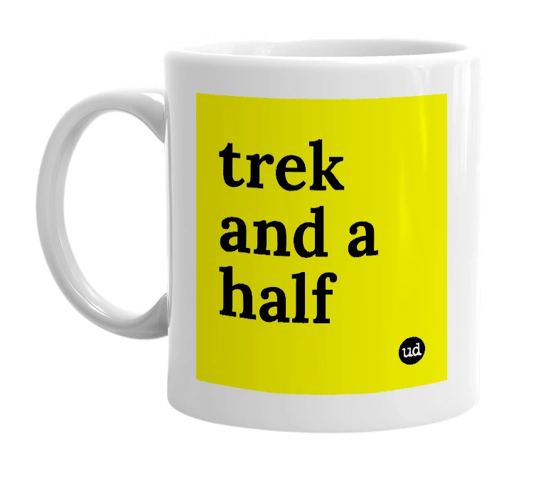 White mug with 'trek and a half' in bold black letters
