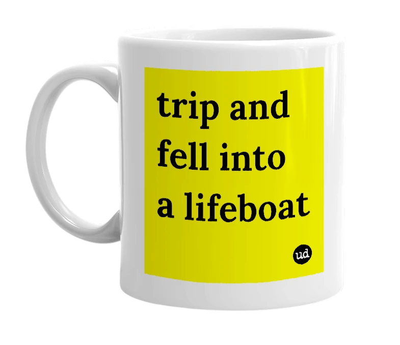 White mug with 'trip and fell into a lifeboat' in bold black letters