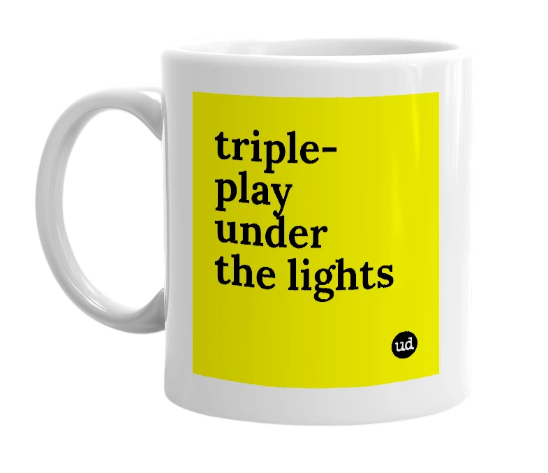 White mug with 'triple-play under the lights' in bold black letters
