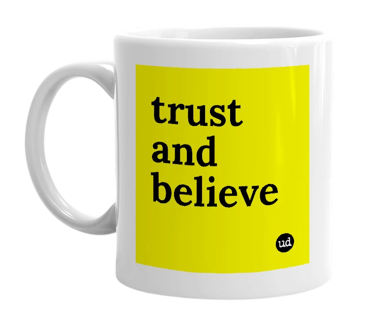 White mug with 'trust and believe' in bold black letters