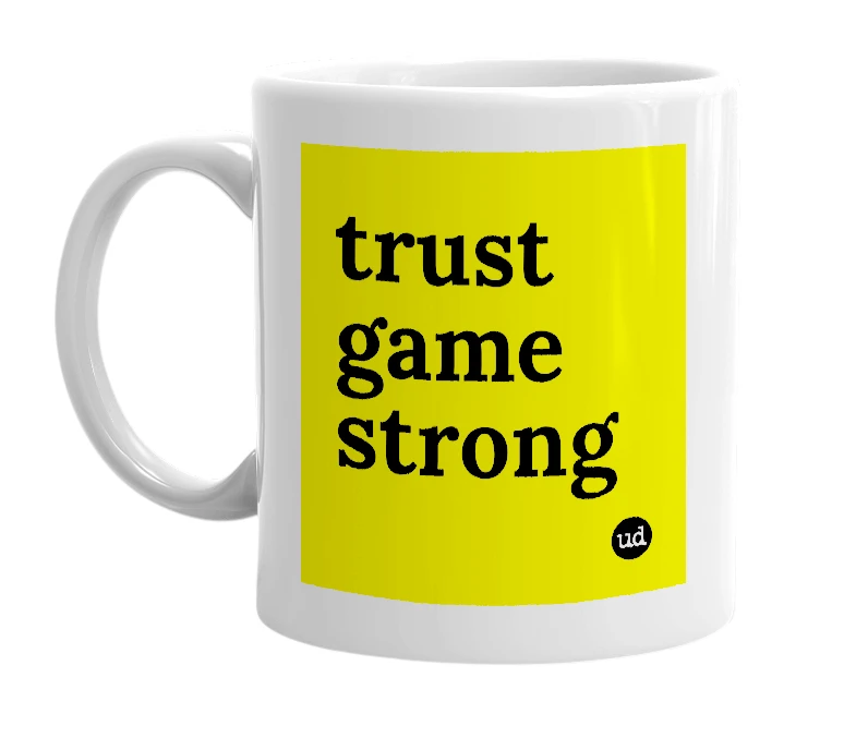 White mug with 'trust game strong' in bold black letters