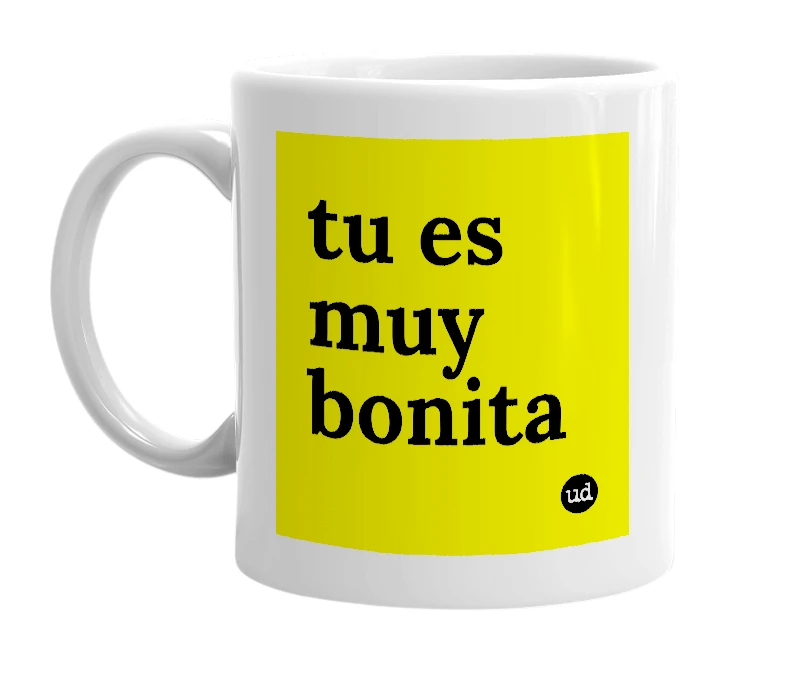 White mug with 'tu es muy bonita' in bold black letters