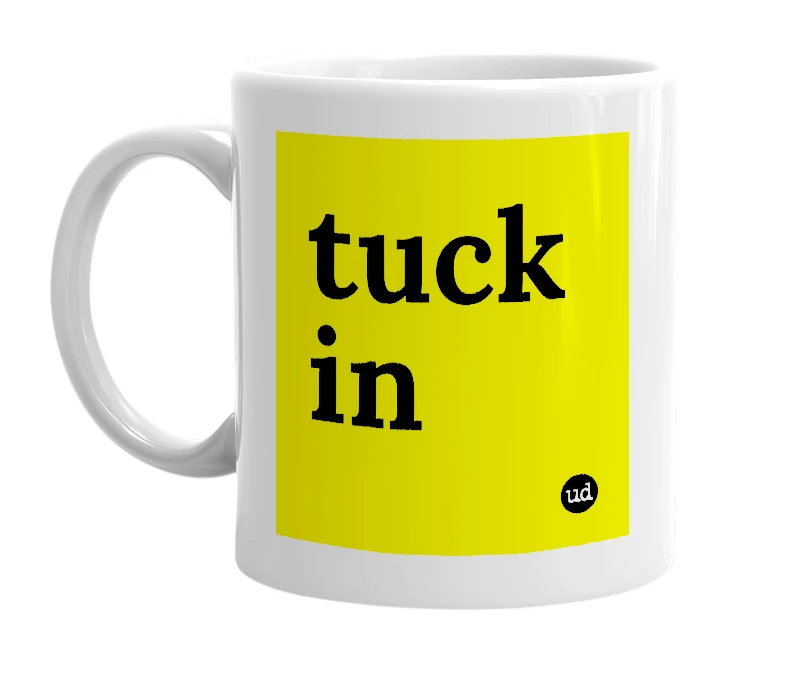 White mug with 'tuck in' in bold black letters
