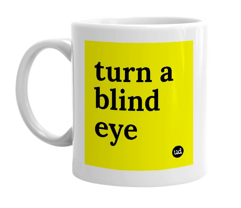 White mug with 'turn a blind eye' in bold black letters