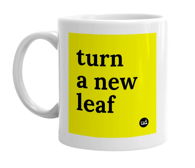 White mug with 'turn a new leaf' in bold black letters