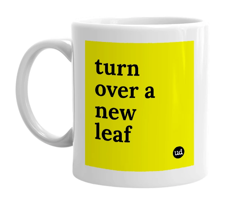 White mug with 'turn over a new leaf' in bold black letters