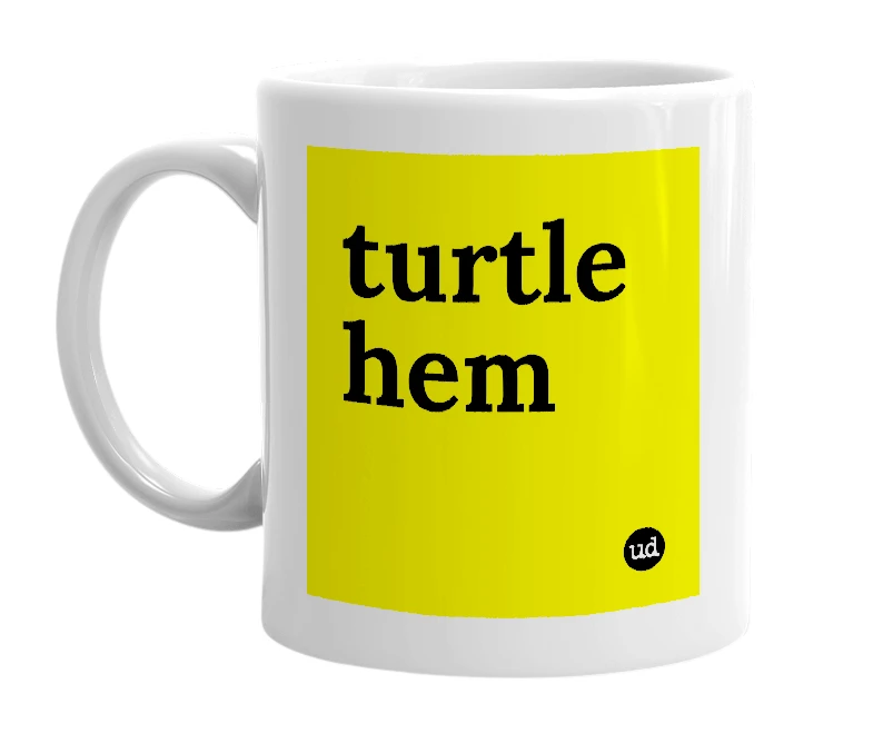 White mug with 'turtle hem' in bold black letters