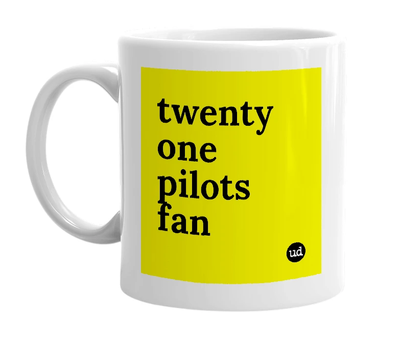 White mug with 'twenty one pilots fan' in bold black letters