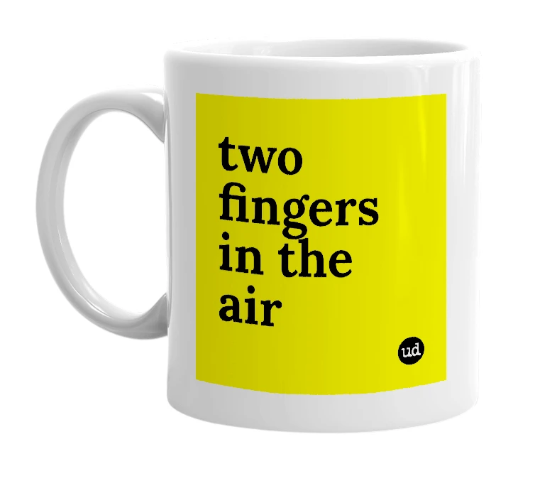 White mug with 'two fingers in the air' in bold black letters