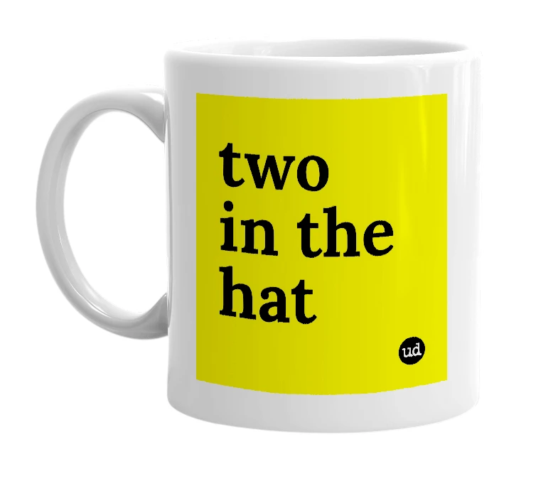 White mug with 'two in the hat' in bold black letters