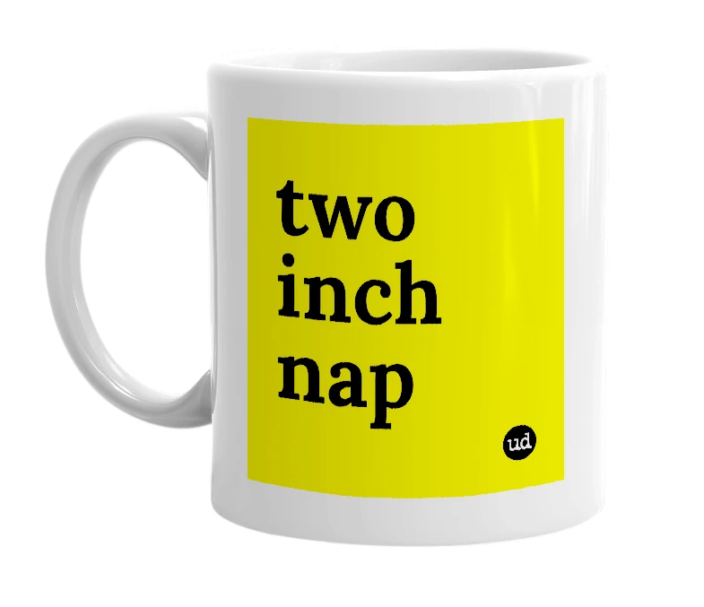 White mug with 'two inch nap' in bold black letters