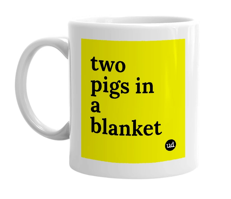 White mug with 'two pigs in a blanket' in bold black letters