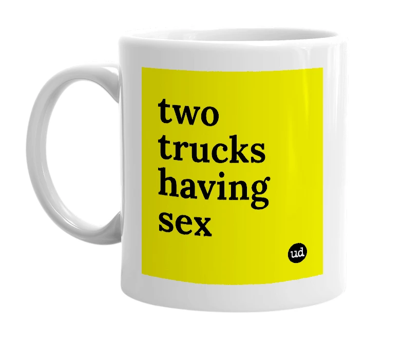 White mug with 'two trucks having sex' in bold black letters