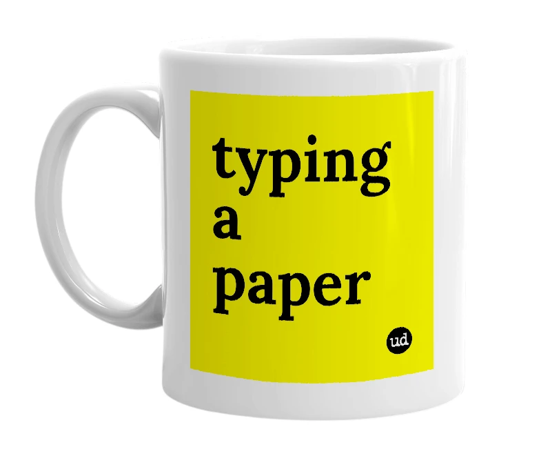 White mug with 'typing a paper' in bold black letters