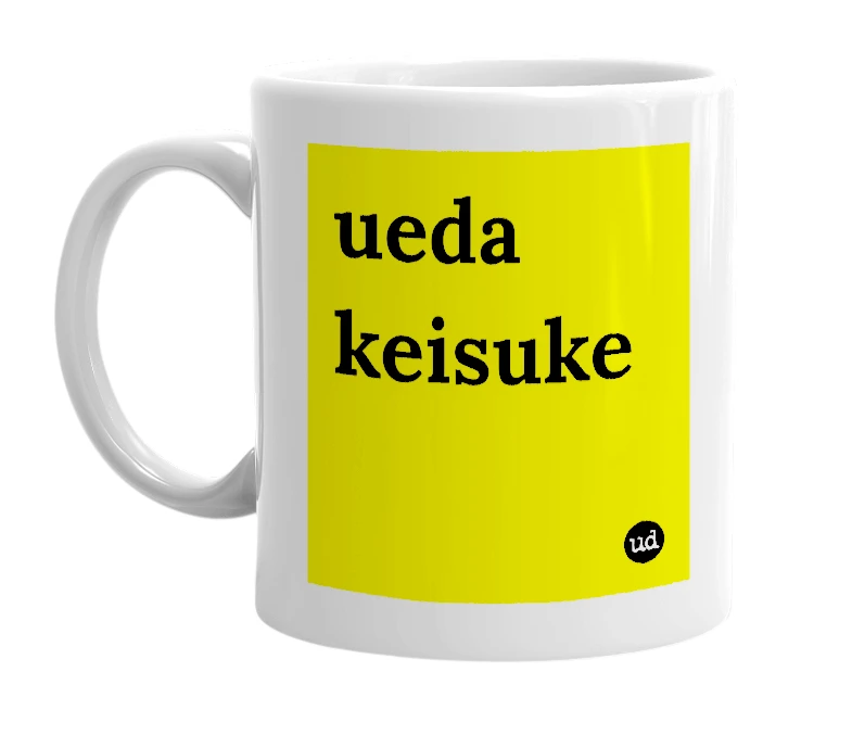 White mug with 'ueda keisuke' in bold black letters