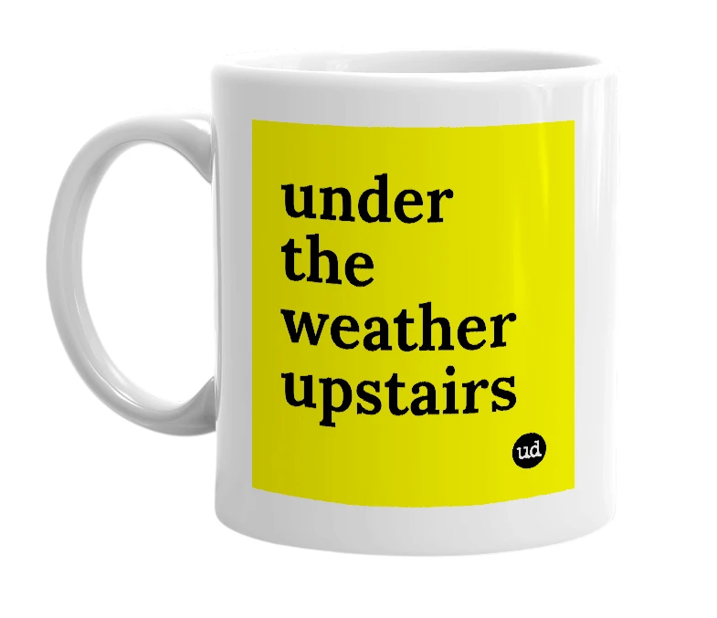 White mug with 'under the weather upstairs' in bold black letters