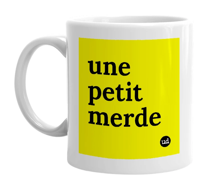 White mug with 'une petit merde' in bold black letters
