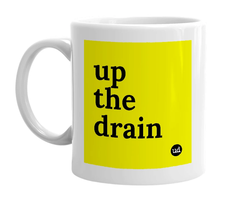 White mug with 'up the drain' in bold black letters