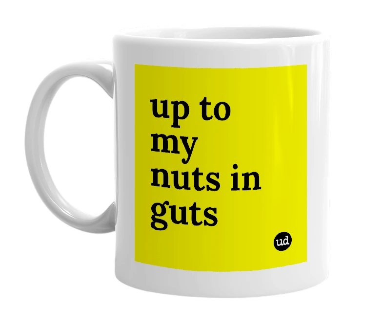 White mug with 'up to my nuts in guts' in bold black letters